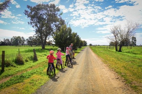 Family cycling in country